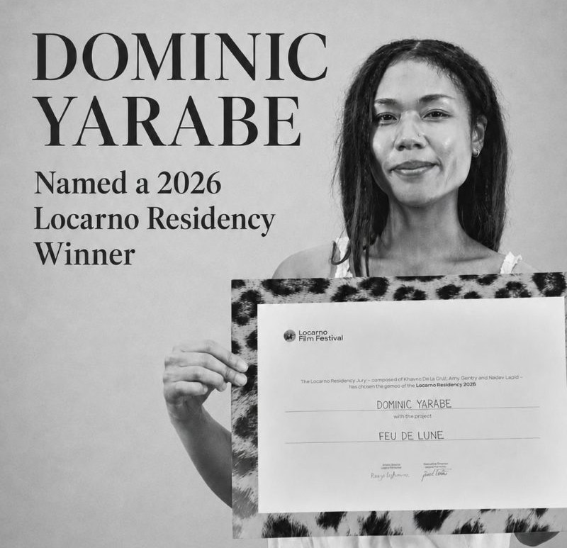 Dominic Yarabe holding her Locarno Residency award certificate